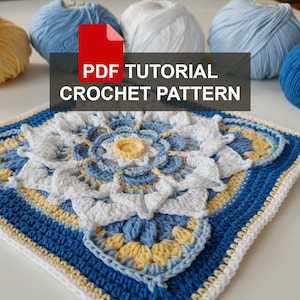 May include: A crochet pattern for a square with a blue, white and yellow flower design. The pattern includes a PDF tutorial.