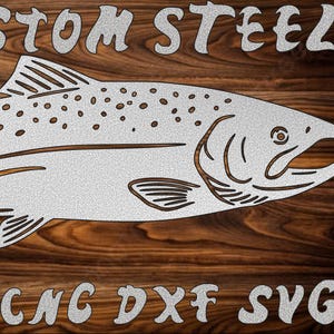 May include: A metal cutout of a fish, with the text "ENI CUSTOM STEEL" above and "PLASMA CNC DXF SVG" below. The fish is silver against a wood grain background.