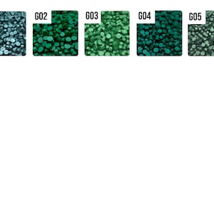 May include: Five samples of green and blue colored round beads. The samples are labeled G01, G02, G03, G04, and G05.