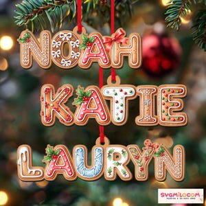 May include: Gingerbread-style Christmas ornaments spelling out the names Noah, Katie, and Lauryn. Each name is crafted with icing details, holly accents, and red ribbon hangers, set against a blurred Christmas tree backdrop.