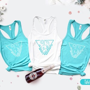 May include: Three turquoise tank tops with white text and a graphic of a desert landscape. The text on the tank tops reads "Abigail's Bachelorette".