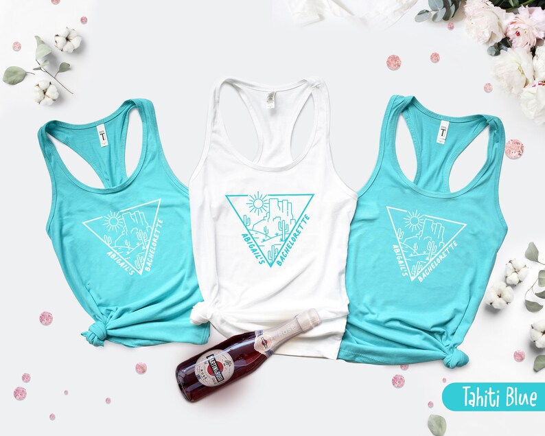 May include: Three turquoise tank tops with white text and a graphic of a desert landscape. The text on the tank tops reads "Abigail's Bachelorette".