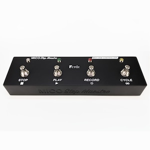 May include: Black MIDI foot controller with four buttons labeled "Stop", "Play", "Record", and "Cycle". The controller has a black and white label that reads "MICO Step Maestro" and a smaller label that reads "MIDI DAW Controller".