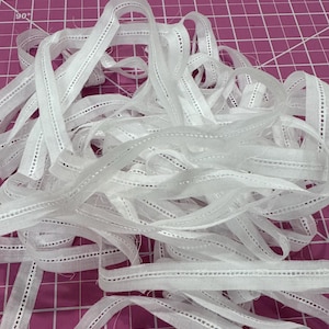 May include: A rustic wooden sign with the text "Welcome to our home" in white lettering. The sign features a distressed finish and a simple, inviting design, perfect for a front porch or entryway.