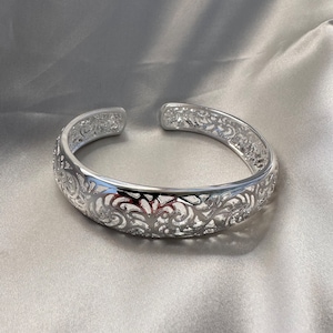 Hollow silver bangle on sale