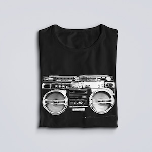 May include: Black t-shirt with a white graphic of a vintage boombox.