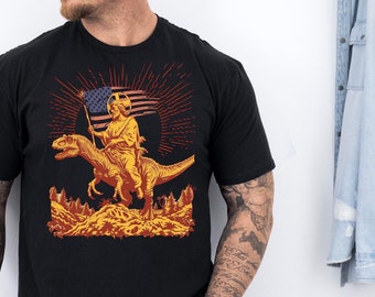 Jesus Riding Dinosaur T-Shirt: USA Flag Graphic Novelty Tee