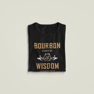 May include: Black t-shirt with a gold graphic that says "Bourbon goes in & wisdom comes out".