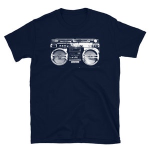 May include: A navy blue t-shirt with a white graphic of a vintage boombox.