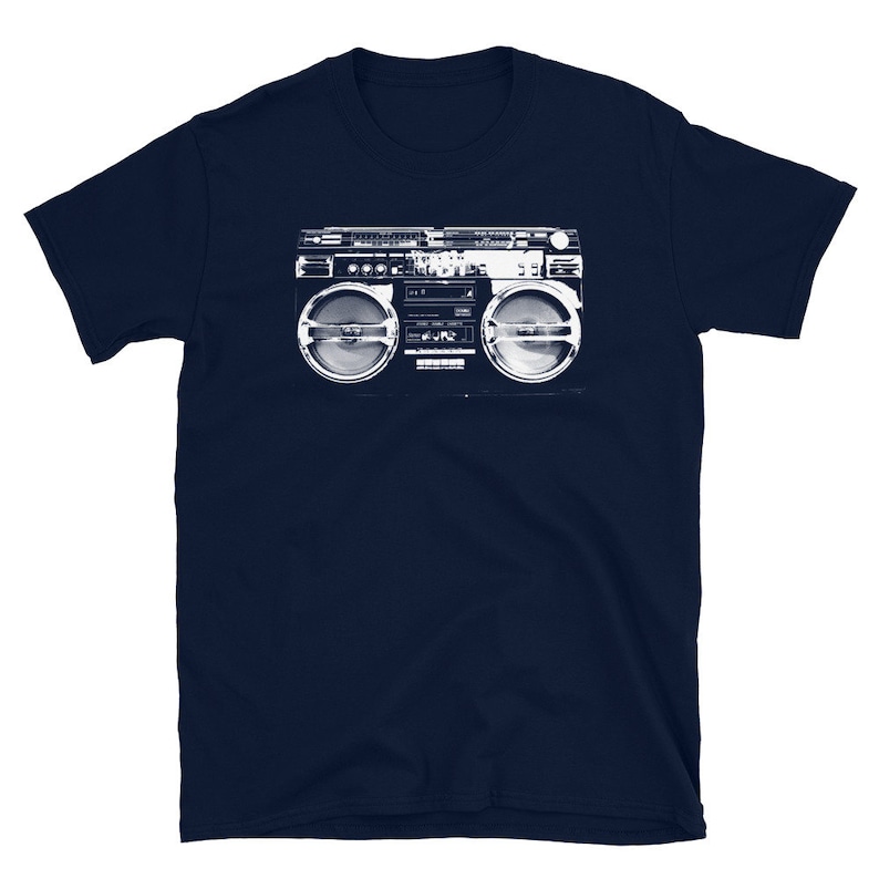 May include: A navy blue t-shirt with a white graphic of a vintage boombox.