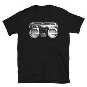 May include: Black t-shirt with a white graphic of a vintage boombox.