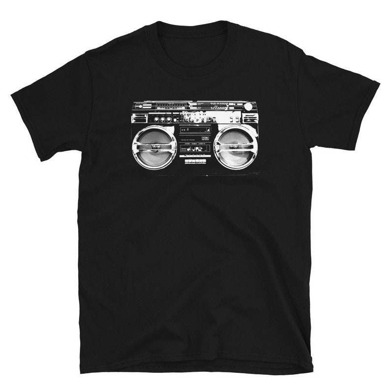 May include: Black t-shirt with a white graphic of a vintage boombox.