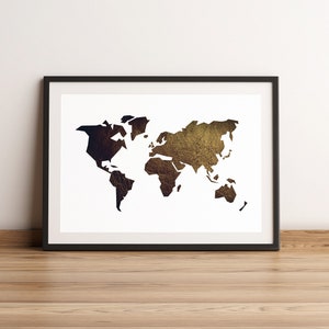 May include: A black framed print of a world map with a gold and brown textured background.