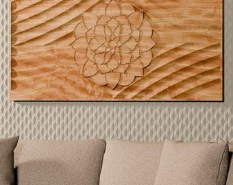 May include: A rectangular wooden wall art piece featuring a central carved floral mandala design surrounded by wavy, textured patterns. The natural light brown wood grain is visible across the surface, which is mounted on a textured wall.