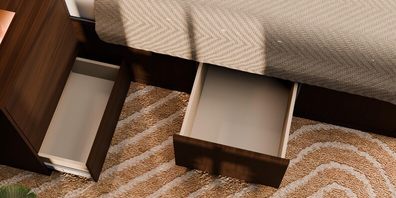 May include: A dark brown wooden bed frame featuring two open storage drawers positioned underneath the base. The drawers have light-coloured interiors and are integrated into the frame, which is partially covered by a textured beige fabric.