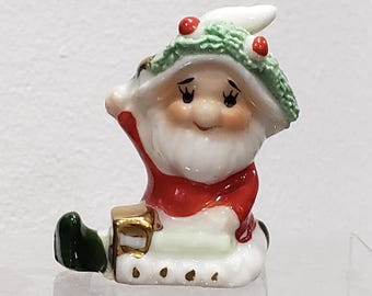 Set of 2 Mismatched Christmas Figurines, One is an Elf by a