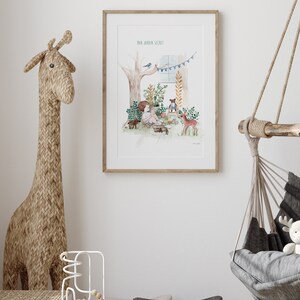 May include: A framed watercolour illustration of a child sitting in a forest clearing with a teddy bear and a deer. The text "Mon Jardin Secret" is at the top of the illustration.