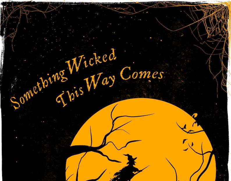 May include: A black graphic print featuring a large orange full moon, a silhouette of a witch flying on a broomstick, and bare tree branches. The text "Something Wicked This Way Comes" is printed in orange, with orange spiderwebs in the corners.
