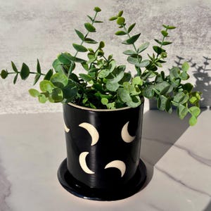 Ceramic planter, moon design, black color, illustration, pottery, slab clay, plant hanging, porcelain, inside, outside planter