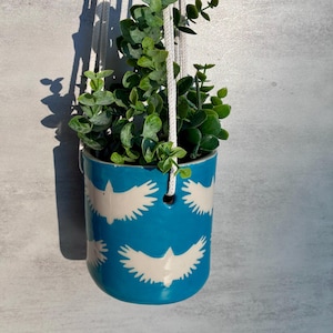 Maceta de cerámica, diseño de halcón, color turquesa, ilustración, alfarería, arcilla laminada, maceta colgante, porcelana, interior, maceta exterior