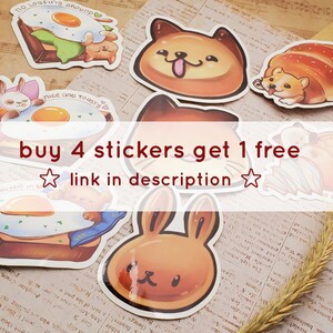 May include: A set of colorful stickers featuring cartoon illustrations of animals and food. The stickers are on a background of a music sheet. The text on the stickers reads "No loafing around", "Nice and toasty", "All tucked in", and "buy 4 stickers get 1 free, link in description".