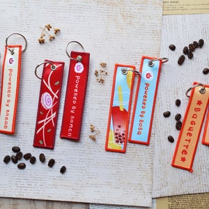 foodie jet tag | flight tag | foodie gift | cute keychain | whimsical cute embroidered keychain | boba, ramen, bread, baguette keychains