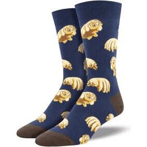 May include: A pair of navy blue socks featuring a repeating pattern of tan tardigrades, also known as water bears. The socks have brown heels and toes. These novelty socks are a fun and unique accessory.