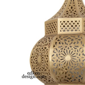 May include: A gold metal lantern with intricate cut-out designs. The lantern has a round body with a pointed top and a hexagonal base.