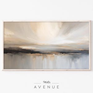 May include: Abstract painting in shades of beige, brown, and gray. The painting depicts a landscape with a horizon line and a sky with clouds. The painting is framed in a light wood frame.