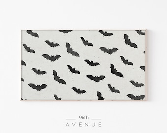 May include: A black and white print with a repeating pattern of bats on a light gray background. The print is framed in a light wood frame.