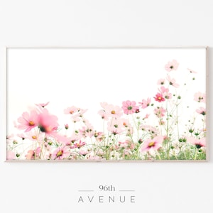 May include: A framed print of a field of pink cosmos flowers against a white background. The print has the text "96th AVENUE" at the bottom.