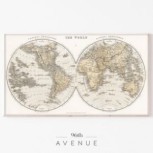 May include: A vintage world map print in black and white with the title "The World" and the words "Western Hemisphere" and "Eastern Hemisphere" at the top. The map is divided into two hemispheres, showing the continents of North America, South America, Europe, Asia, Africa, and Australia.