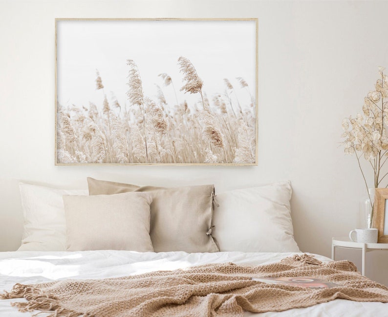 May include: A framed print of a field of tall, dried grasses in shades of beige and brown against a white background.