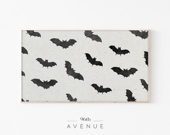 May include: A black and white print of a repeating pattern of bats on a white background. The print is framed in a light wood frame.