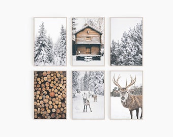 May include: Set of six winter-themed prints featuring a snowy forest, a wooden cabin, a pile of logs, and a deer. The prints are in a rustic style and would be perfect for a winter-themed home decor.