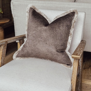 mocha textured velvet look cushion cover with fringe.