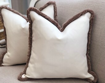 cream fringe pillow