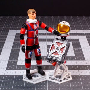 Présentoir pour jet pack et casque Major Matt Mason (figurines, casques et jet pack non inclus)