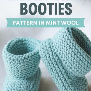 May include: Two knitted baby booties in a soft mint green colour. The booties are made of wool and have a textured appearance. The text "KNITTED BABY BOOTIES" and "PATTERN IN MINT WOOL" are displayed at the top of the image.