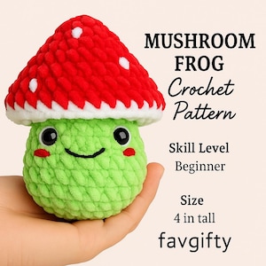 May include: A crocheted mushroom frog with a red cap dotted with white spots, a white trim, and a green body. The frog has black eyes and a smiling mouth. The text on the image says "Mushroom Frog Crochet Pattern" and "4 in tall".