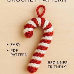 May include: A crocheted candy cane in red and white stripes, with a loop for hanging. The image includes text that reads "Candy Cane Crochet Pattern", "Easy", "PDF Pattern", "Beginner Friendly", and "Instant Download".