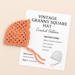 Puede incluir: Un gorro de bebé de ganchillo naranja con un diseño de granny square, junto a un papel blanco con el texto "VINTAGE GRANNY SQUARE HAT Crochet Pattern". El patrón incluye instrucciones y es para tallas de 0 a 6 meses.