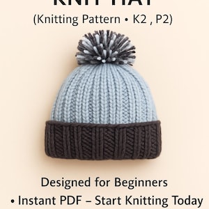 May include: A knitted infant hat with a ribbed design, featuring a light blue crown and a dark brown brim. The hat is topped with a gray and white pom-pom. Text on the image reads "INFANT RIBBED KNIT HAT" and "Designed for Beginners."