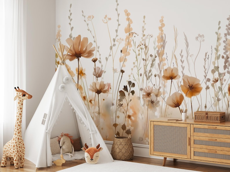 May include: A children's room with a white teepee tent, a giraffe plush toy, and a wooden cabinet. The wall features a floral mural in shades of brown and beige, creating a warm and inviting atmosphere. A woven basket and decorative pillows add to the cozy feel.