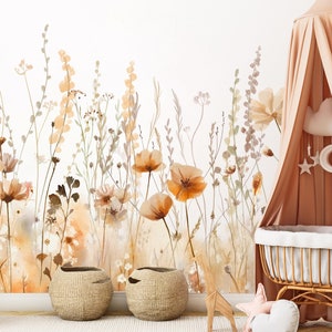 May include: A nursery scene featuring a floral wallpaper with watercolor-style flowers in shades of orange, brown, and beige. A giraffe toy, two woven baskets, and a canopy bed with a decorative mobile complete the room's decor.