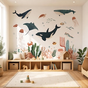 May include: A children's room with a marine theme. The white wall features illustrations of whales, a manta ray, a killer whale, and other sea creatures. A wooden bench with storage and a rug complete the scene.