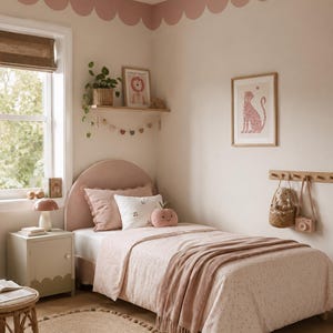 May include: A cozy bedroom scene with a blush pink color scheme. The room features a twin bed with a patterned comforter, a pink throw blanket, and decorative pillows. A round jute rug and a small side table with a lamp complete the space.