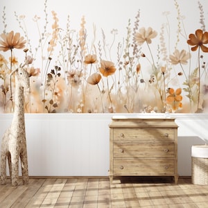 May include: A watercolor mural of wildflowers in shades of orange, brown, and beige adorns a white wall. A wooden dresser with three drawers and a woven giraffe statue stand in front of the wall. A woven basket sits to the right.