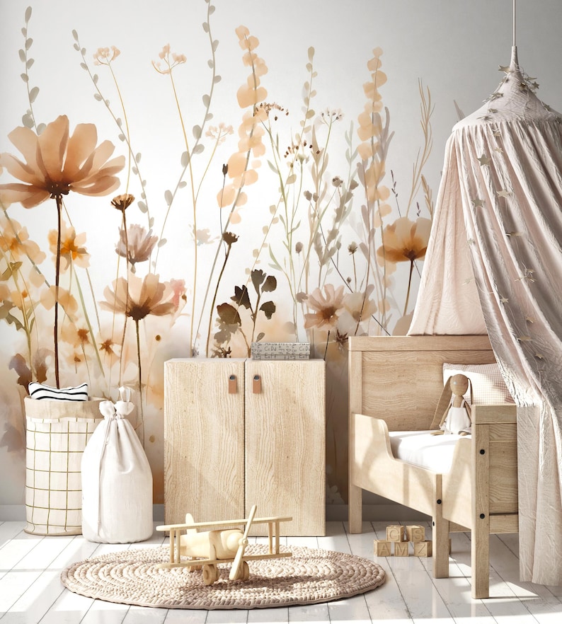 May include: A nursery scene with a floral wallpaper in shades of peach and brown. A wooden bed, cabinet, and toy airplane are featured. A round rug and a canopy add to the room's decor. A basket and a drawstring bag are also present.