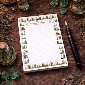 May include: A notepad with the text "Magical Potions" and lined pages, decorated with illustrations of potion bottles and books. A black fountain pen rests beside the notepad on a wooden surface, surrounded by potion bottles and crystals.